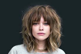 Having this type of length gives you enough hair to work on but not too much of a strain to maintain, perfect for her. 50 Nice And Flattering Hairstyles With Bangs Lovehairstyles Com