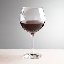 wine glass filled with red wine as a