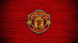 yellow red manchester united logo in