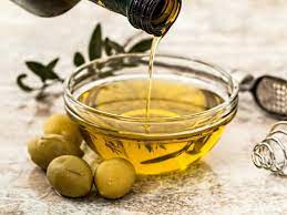 applying olive oil on skin