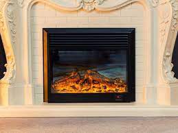 an electric fireplace in a real fireplace