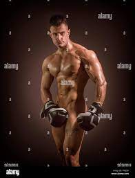 Naked male bodybuilder hiding crotch with boxing gloves Stock Photo - Alamy
