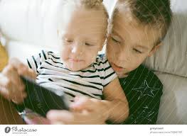 kids spending home leisure with mobile
