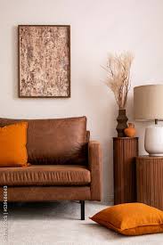 mock up poster frame brown sofa