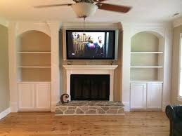 Cabinet And Shelves Beside Fireplace