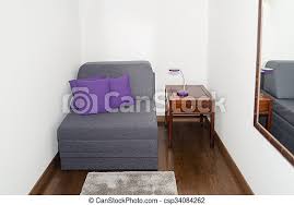 Maybe you would like to learn more about one of these? Comfy Gray Armchair With Purple Pillow Near A Small Table With Modern Night Lamp Armchair In A Small Room For Guests Rest Canstock