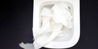 How do you dissolve clogged toilet paper?