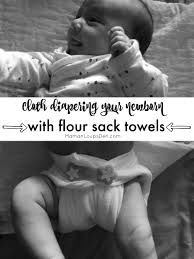 newborn with flour sack towels