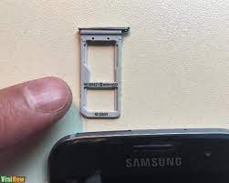 The top edge of the phone, which is marked by a thin rectangular slot with a tiny pinhole. Remove A Sim Card From The Samsung Galaxy S7 Edge Visihow