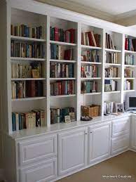 built in bookshelves with cabinets don