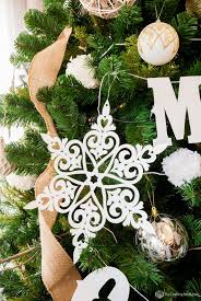 diy glittered snowflake paper ornaments