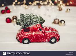 Christmas Present Red Car Toy With Christmas Tree On Top On