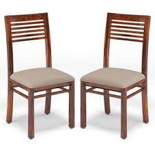 Thanks to the thickly padded seat and backrest, these artificial leather chairs are very comfortable to sit on. Zella Dining Chairs Set Of 2 Urban Ladder