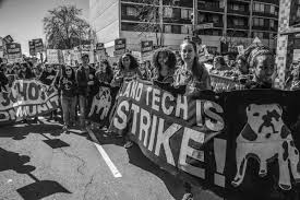 photo essay oakland teachers fight for public education teachers and students carry a banner from their school oakland technical high school