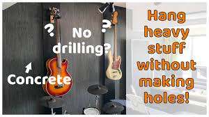 hang guitars without drilling holes in