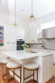 open white kitchen with island seating