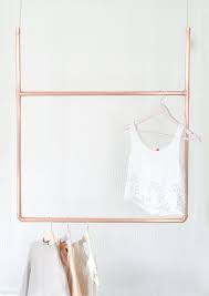 It is a kind of a movable bar which, with a practical handle, can be lowered to any height, for example, to hang up the coat hanger. Copper Pipe Hanging Display Clothing Rail Clothes Storage Little Deer