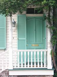 Turquoise dutch cottage door is good on a house with a gray color scheme. Do Something Unexpected Bright Doors Aqua Front Doors Front Door Colors House Exterior