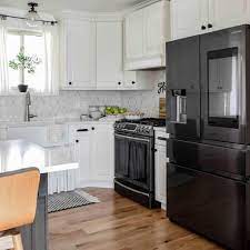 9 white kitchens with black appliances
