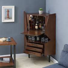 A wide variety of corner liquor cabinet options are available to you, such as home furniture, commercial furniture. Carson Carrington Haramsoya Dark Tobacco Geometric Corner Bar Cabinet Overstock 22833509