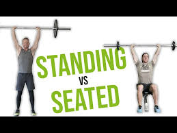standing shoulder press vs seated