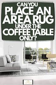 Rugs that are too small for their space disrupt the balance of scale in a room. Can You Place An Area Rug Under The Coffee Table Only Home Decor Bliss