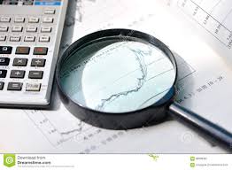 A Magnifying Glass Focusing On Stock Chart Stock Image