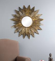 metal round wall mirror in gold