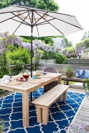 Since the stores are already putting out fall stuff in the beginning of august (why???), i snagged this simple outdoor umbrella from pier 1 on clearance. How To Build An Outdoor Dining Table Finding Silver Pennies