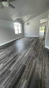 grey living room with vinyl floors