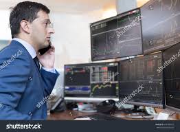Stock Broker Trading Online While Accepting Stock Photo Edit Now