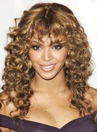 The accentuated baby hair, center part, tight coils = everything. 12 Long Curly Hairstyles With Bangs Curly Hair Styles Naturally Curly Hair With Bangs Curly Hair Styles