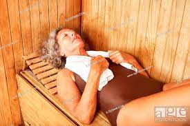 Alte Frau entspannt in der Sauna oder im Dampfbad im Wellness Hotel, Stock  Photo, Picture And Rights Managed Image. Pic. ZON-12345511 | agefotostock