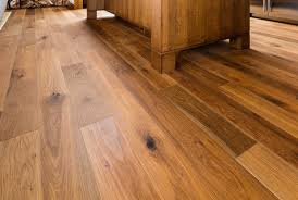 laying laminate wood floor over tiles