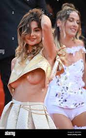 Cannes, France. 06 July 2021, A guest flashing her boobs during the Opening  Ceremony of the