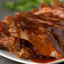 tender boneless country style pork ribs slow cooked with a zesty finger licking bbq sauce hold the