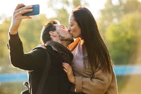 take selfie by mobile phone kissing