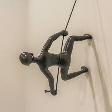 Practical in its proportions and ideal for narrow accent walls, this symbolic piece adds dimension to. Climbing Man Position 6 Silver Hanging Wall Art Touch Of Modern