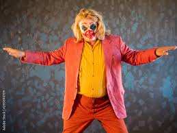 portrait of male clown in pink dressed