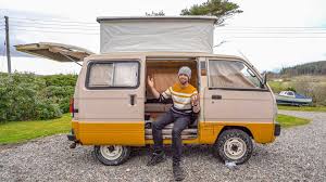 tiny suzuki cer van with a pop top