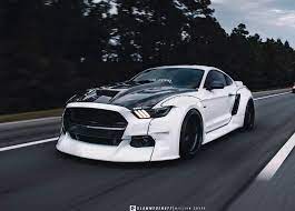 Great room decor for a den, man cave or garage or a wonderful gift for a classic car enthusiast or anyone who loves old sportscars or american muscle cars. Black White Widebody Ford Mustang Gt With Airride