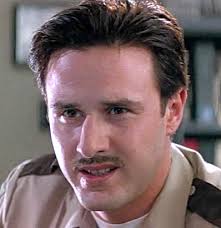They may not all have survived the film, but surviving Hollywood is a much bigger feat! By Danielle Turchiano. David Arquette as Deputy Dewey Riley - scream-david-arquette-GC