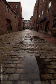 cobblestone street after rain storm