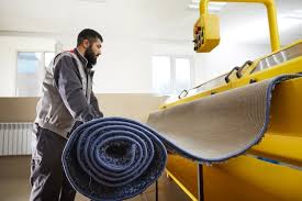 man operating carpet automatic cleaning