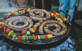 a bbq grill and homemade boerewors