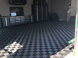 Strong and resilient, these floors stand up to traffic and the occasional dropped wrench. Best Garage Floor Tiles Mat Or Paint The Money Pit