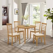 If you don't want the hassle of matching chairs to your table, then this round dining set takes out the guesswork. Small Solid Wooden Drop Leaf Round Dining Table And 4 Chairs Set In Oak Finish Ebay