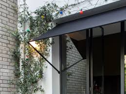 Used to provide awning support from the awning end rail to the ground. This Is The Right Way To Do A Door Awning Architectural Digest
