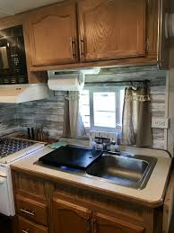 What creative ways have you used wallpaper to decorate your home or furniture? Camper Kitchen Camper Kitchen Kitchen Backsplash Designs Space Saving Kitchen