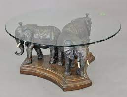 coffee table with triple elephant base